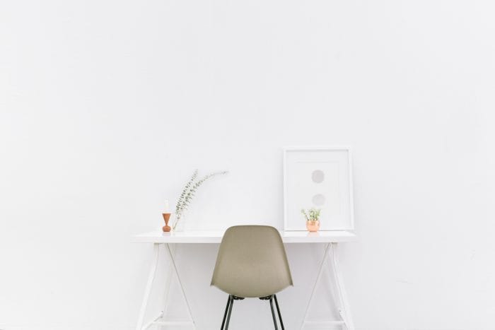 White room with desk and chair