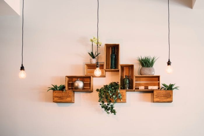 Lights against crates mounted on wall