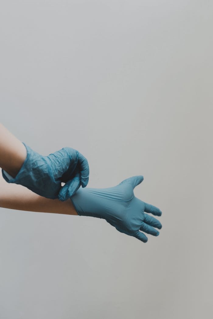 Person putting on gloves