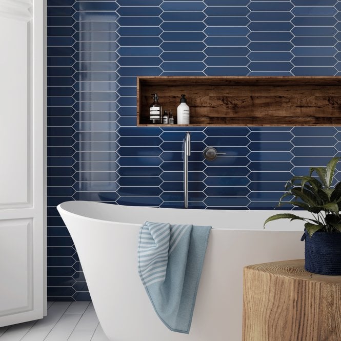 blue arrow bathroom tiles with white tub